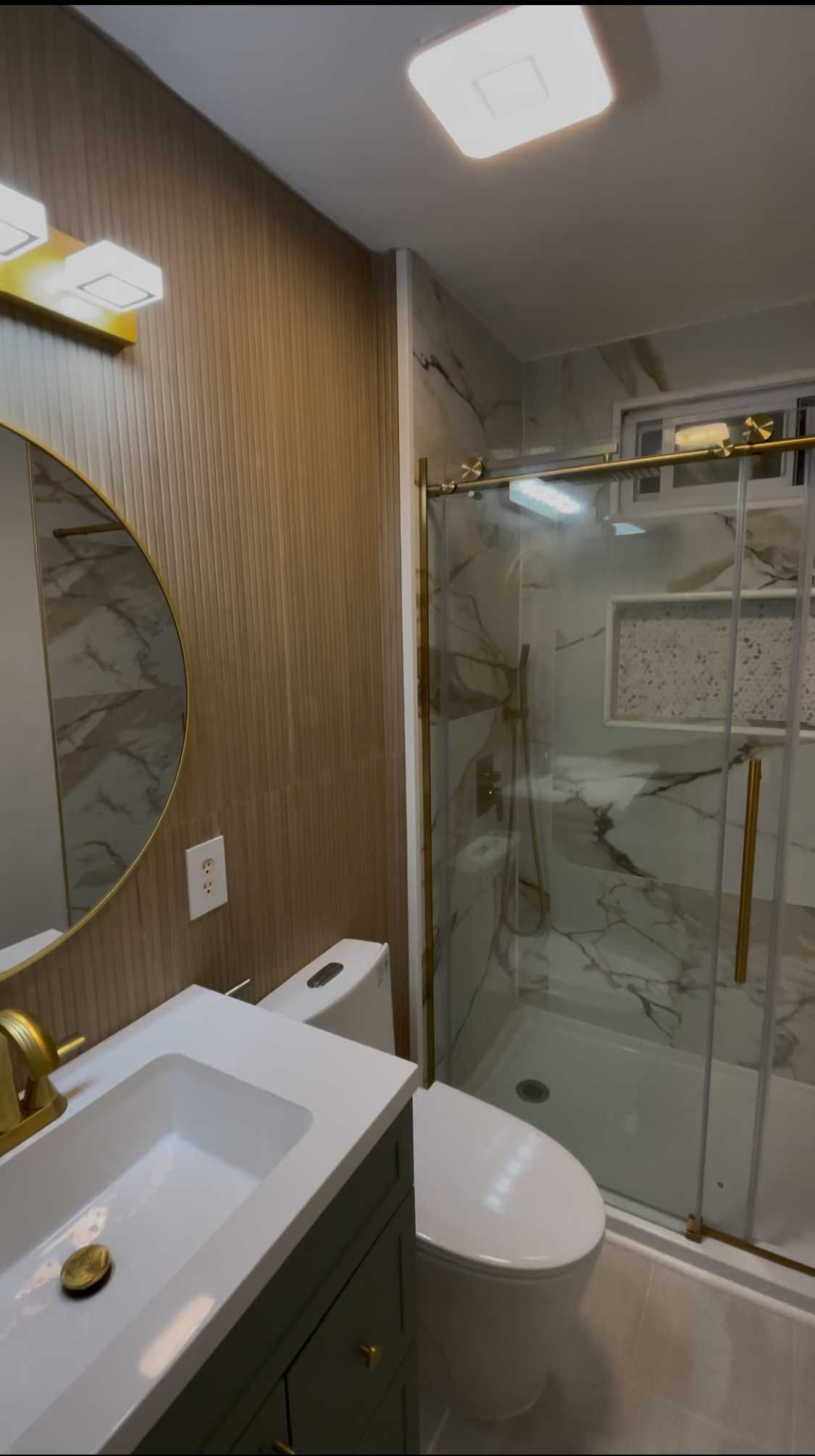 Large-format tile vanity wall with aligned layout and finished edges