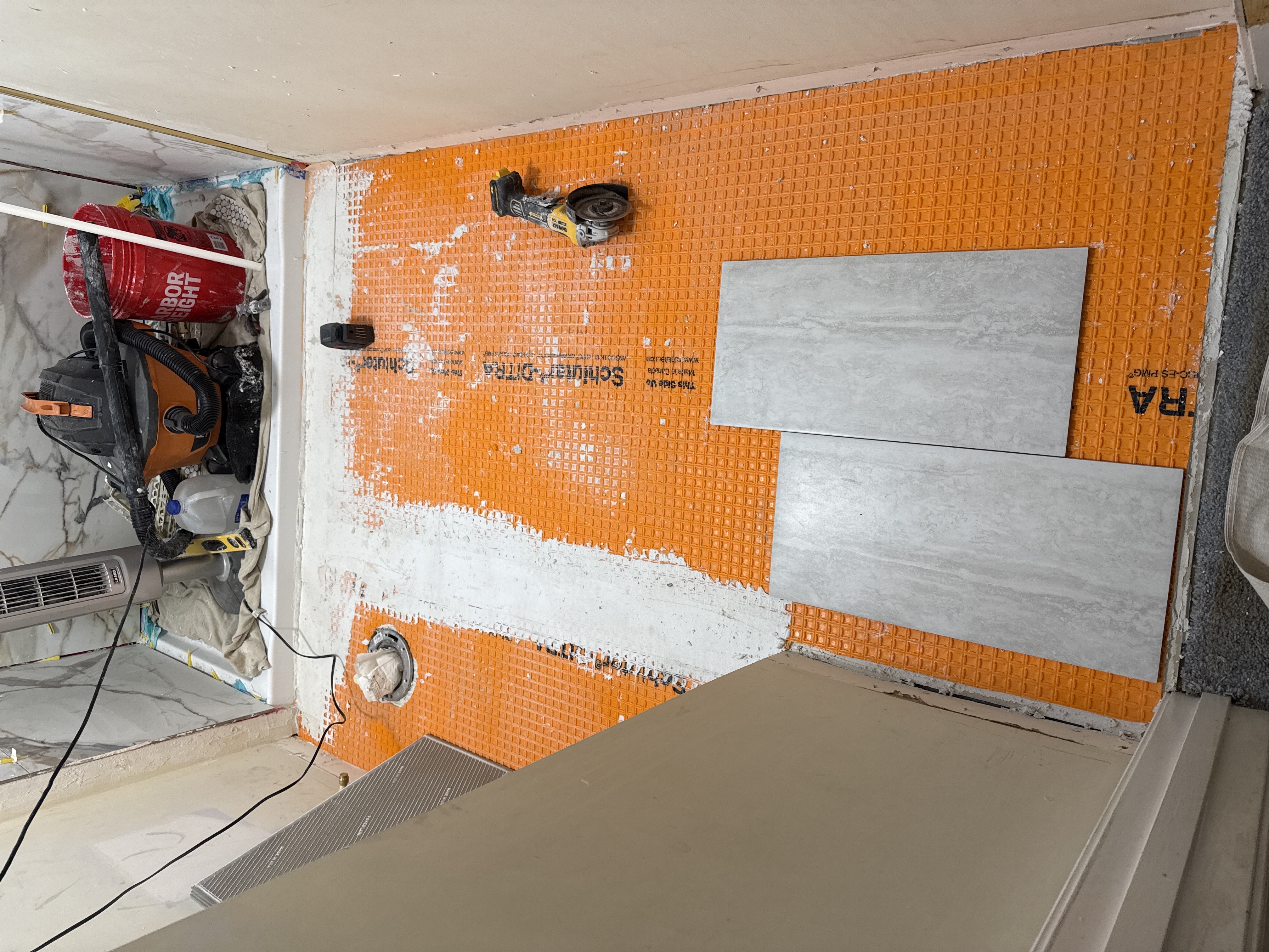 Uncoupling or waterproofing membrane installed over a prepared substrate for tile assembly